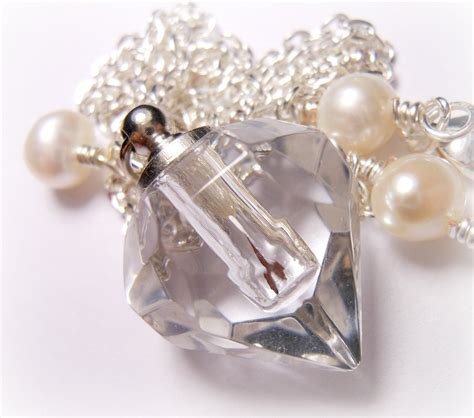 faceted perfume bottle necklace.